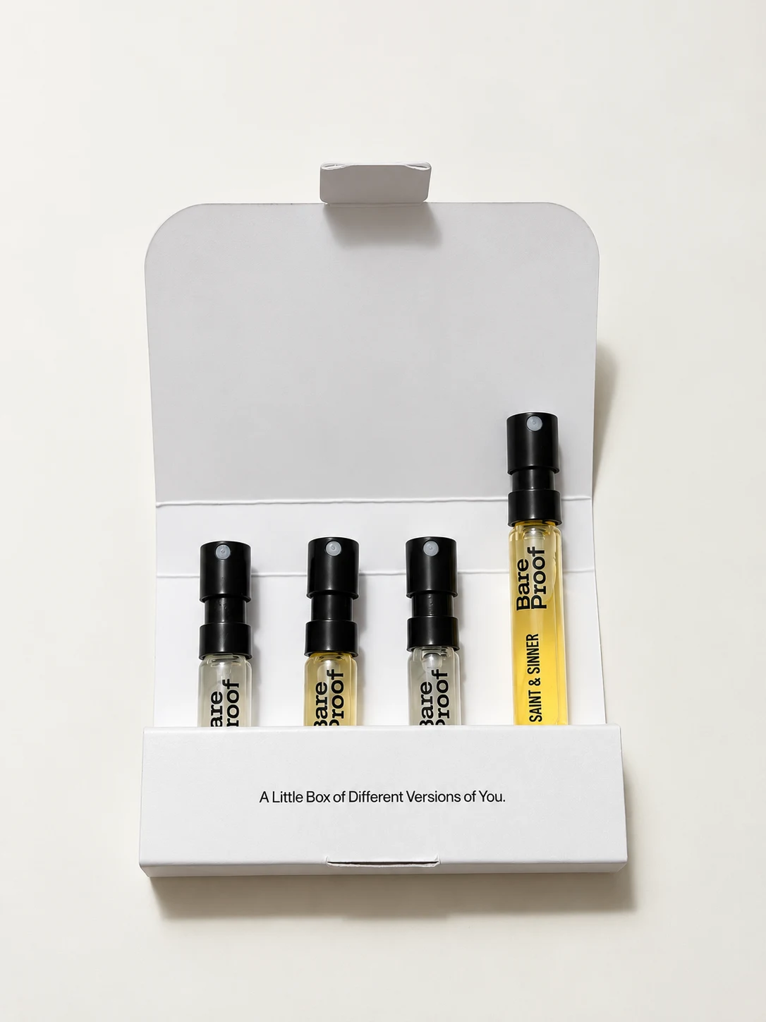 Front view of the open Try Any Four kit with four perfume samples